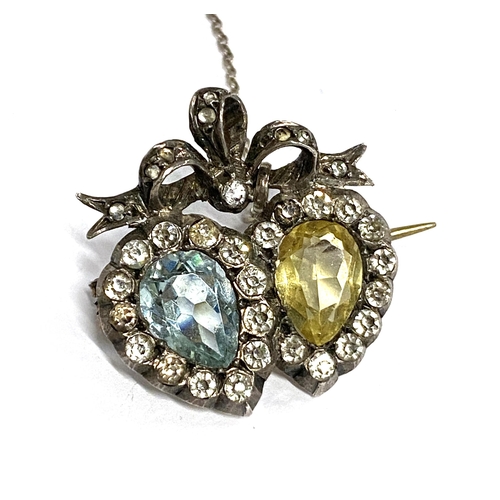 45 - An Edwardian silver double heart brooch set with citrine and aquamarine paste, with safety chain, 2.... 