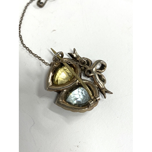 45 - An Edwardian silver double heart brooch set with citrine and aquamarine paste, with safety chain, 2.... 