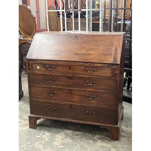 1107 - A George III mahogany bureau fall front above four graduating drawers on bracket feet, 101cmW