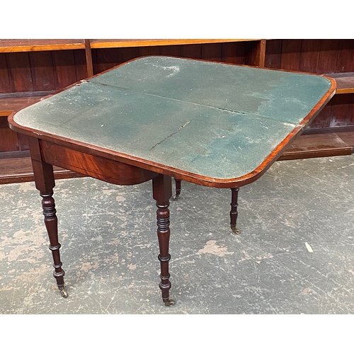 1025 - A 19th century mahogany card table, on turned tapering legs and brass casters, 91x45x73cmH