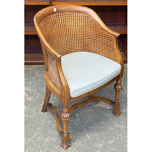 1115 - A 20th century caned bergere chair, with squab cushion, 57cmW