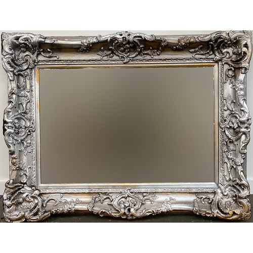 770 - A large silver painted gesso mirror, the bevelled glass, 94x122cm