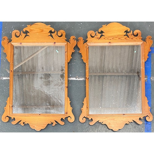 774 - Interior design interest: A pair of pine fret carved wall mirrors, each 52x78cm