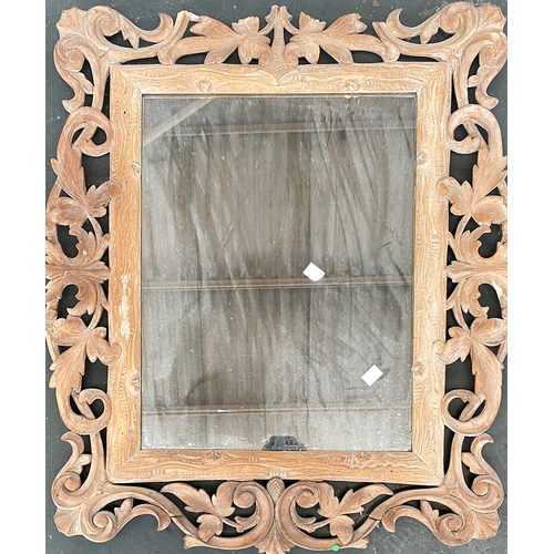 780 - Interior design interest: A carved and pierced rectangular wall mirror, carved with scrolling vines,... 