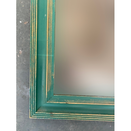 756 - A green painted pine long mirror, 131x41cm