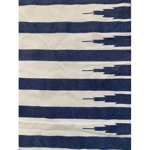 786 - A large flatweave blue and white striped rug, 420x298cm