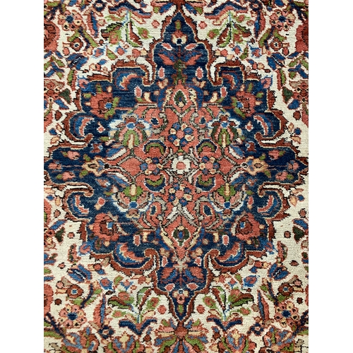 790 - A blue ground rug with floral border and sprays (af), 140x205cm