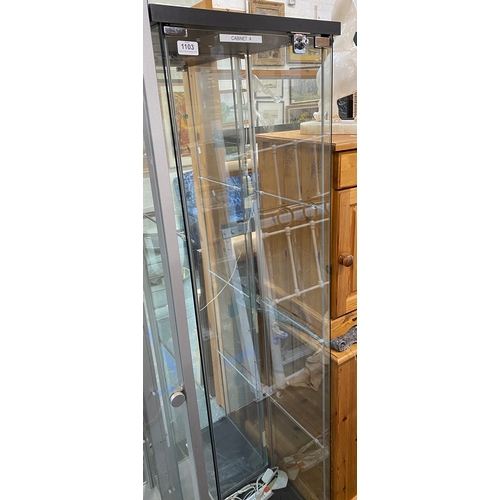 1102 - A modern glazed display cabinet, with mirrored back, 58x32x172cm (labelled cabinet 11)