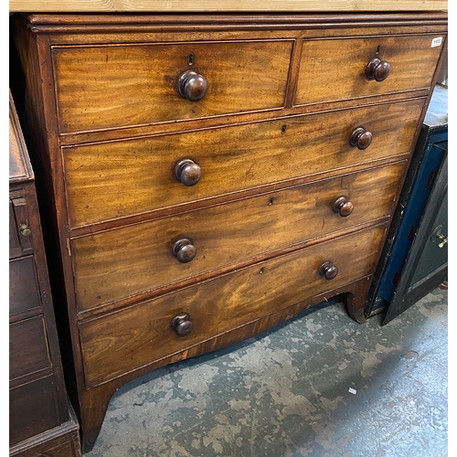 1113 - An early 19th century mahogany chest of two short over three graduating drawers, on swept bracket fe... 