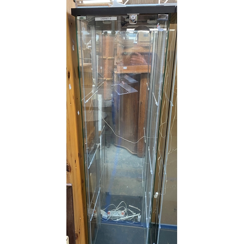 1127 - A modern glazed display cabinet, with LED lighting, 37x43x163cm (labelled cabinet 8)