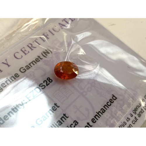 57 - A 2.5ct tangerine garnet; together with 6.6cts of mandarin garnets