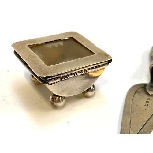 65 - A silver lidded stamp box, hallmarked for Birmingham 1900; together with a silver bookmark, hallmark... 