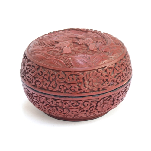 225A - A Chinese cinnabar lacquer circular lidded pot, the lid depicting figures within a landscape, 11.5cm... 