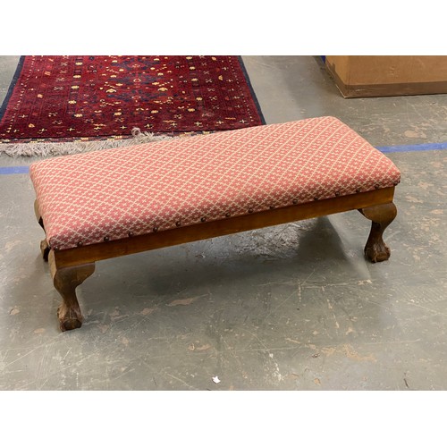 1106 - A long upholstered footstool with hinged seat, 78cmL