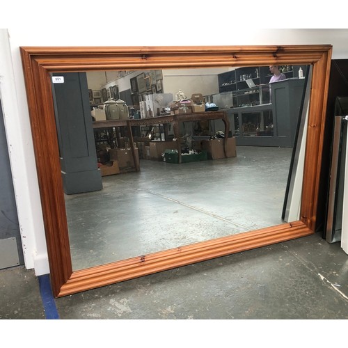 775 - A large rectangular pine mirror, 97x138cm