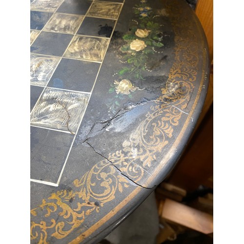 912 - A Victorian painted slate and black lacquer tripod games table, mid 19th century, the slate top pain... 