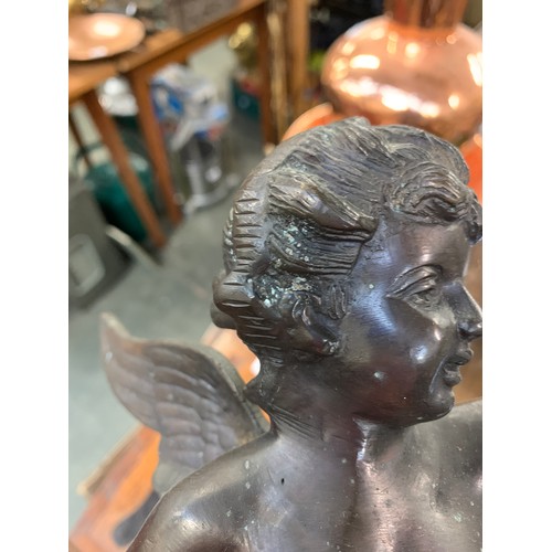 259 - A spelter figure of a cherub, 34cmH