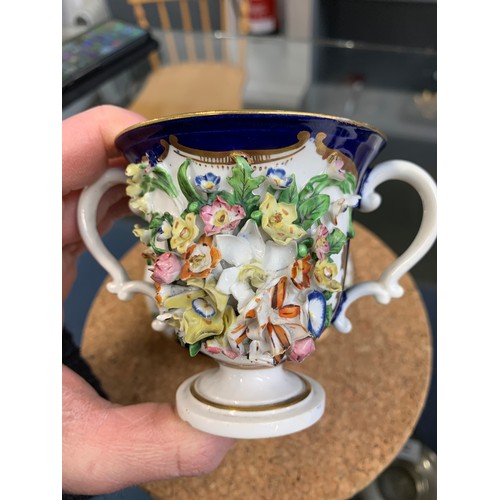 362 - A 19th century Derby porcelain twin handled cup and saucer with floral encrusted decoration, 8cmH