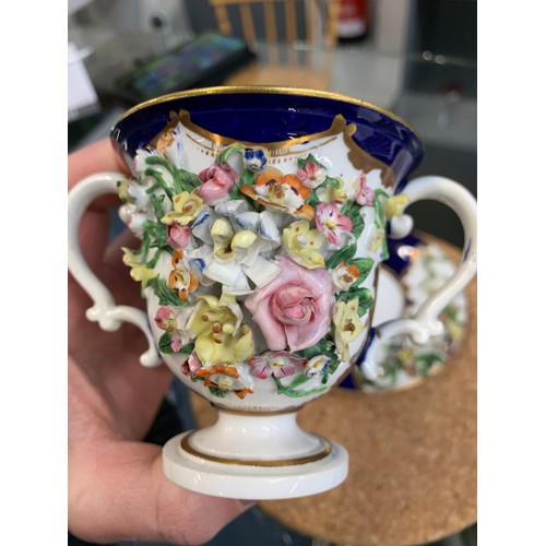 362 - A 19th century Derby porcelain twin handled cup and saucer with floral encrusted decoration, 8cmH