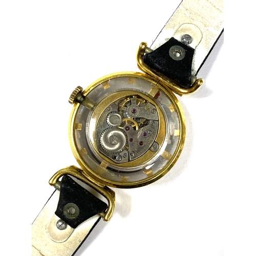 78 - A vintage ladies Juvenia skeleton watch, bullseye dial in a gold plated case, the movement marked Ju... 