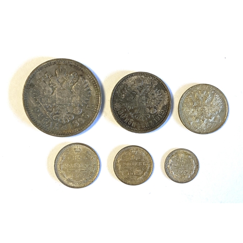 62 - A collection of late 19th/early 20th century Russian Empire Nicholas II silver coins: 1 ruble coin, ... 