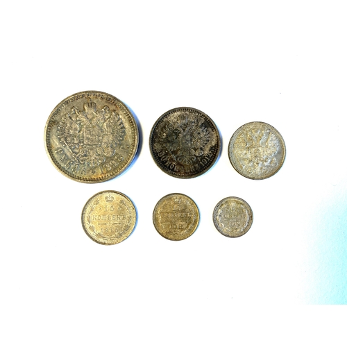 62 - A collection of late 19th/early 20th century Russian Empire Nicholas II silver coins: 1 ruble coin, ... 