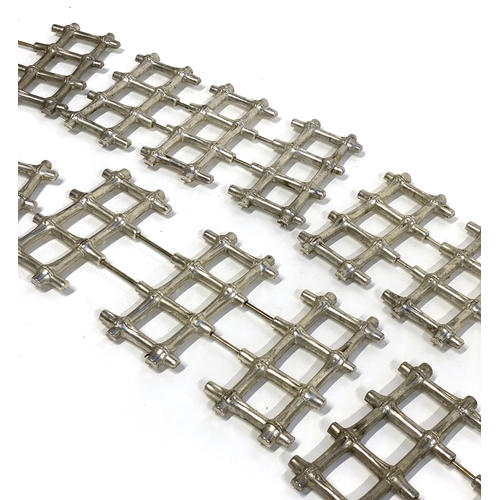 241 - Six extending metal bamboo form trivets