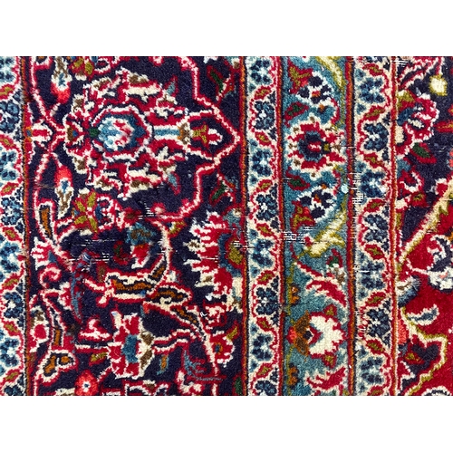 622 - A very large Persian carpet, red ground, 385x295cm