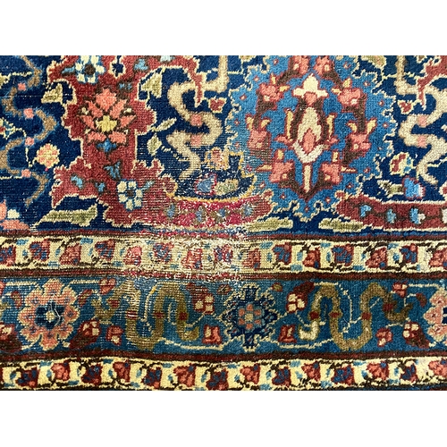 633 - A very large Persian wool rug with central medallion, 450x345cm