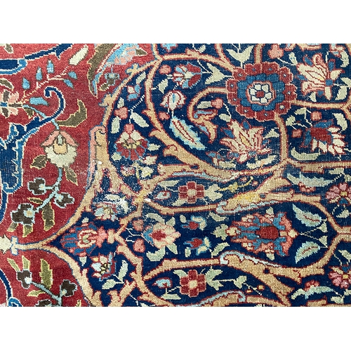 633 - A very large Persian wool rug with central medallion, 450x345cm