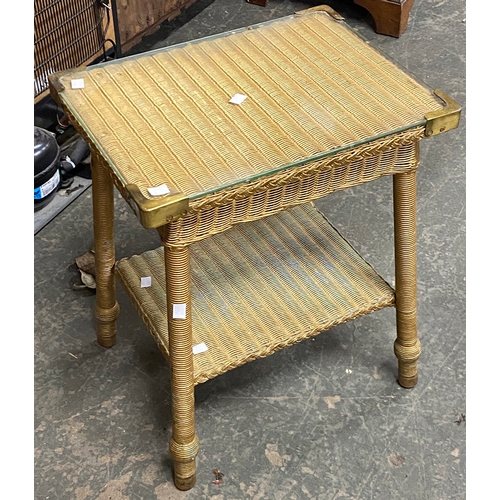 834 - An early 20th century mahogany piano stool with single drawer; together with a Lloyd Loom style occa... 