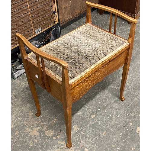 834 - An early 20th century mahogany piano stool with single drawer; together with a Lloyd Loom style occa... 