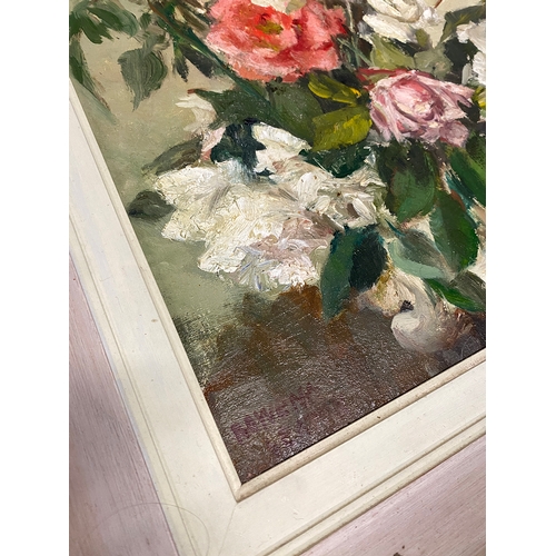 556 - Rowena Seaton, 20th century still life of roses, oil on canvas, sighed lower left, 44.5x33.5cm