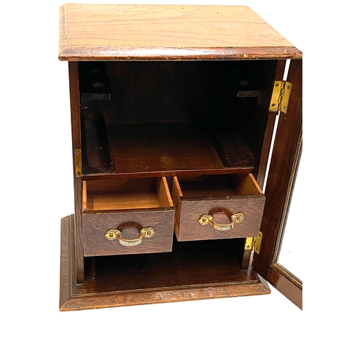 297 - A glazed oak smoker's cabinet, 36.5cmH