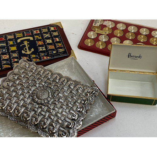 298 - A set of gold and silver plated backgammon stones retailed by Harrods; together with an enamel Harro... 