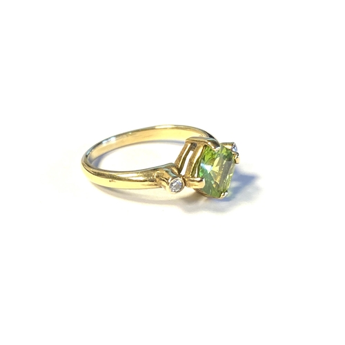 35 - A 9ct gold, peridot and diamond ring, the fancy cushion cut peridot measuring 7mm wide, size N 1/2, ... 