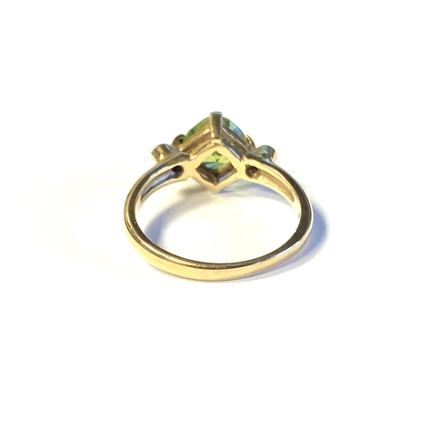 35 - A 9ct gold, peridot and diamond ring, the fancy cushion cut peridot measuring 7mm wide, size N 1/2, ... 