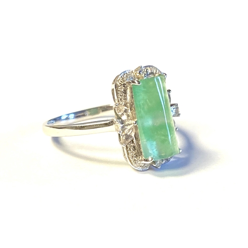 36 - An 18ct white gold ring set with jade, surrounded by white sapphires and small diamonds, size M 1/2,... 