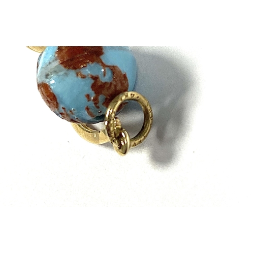 5 - A vintage 14ct gold and glass charm in the form of a desk globe, 1.9cmL, 2.1g