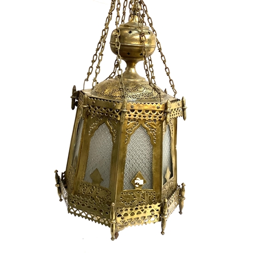 262 - A large octagonal Moroccan brass and glazed lantern, 77cml