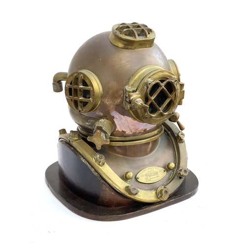 263 - A brass and copper US navy diving helmet, bears a label 