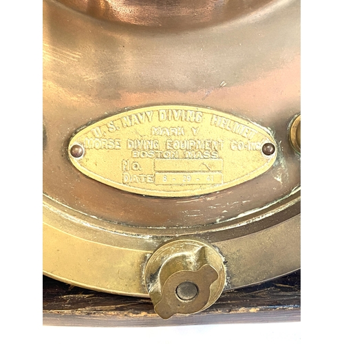 263 - A brass and copper US navy diving helmet, bears a label 