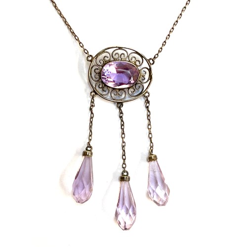 22 - An early 20th century silver and amethyst negligee necklace, the central amethyst in an openwork set... 