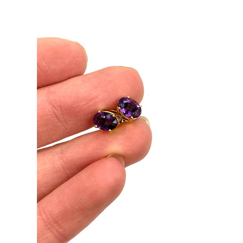 37 - A pair of 18ct gold and amethyst stud earrings, the amethyst approx. 7x5mm, gross weight 1.9g