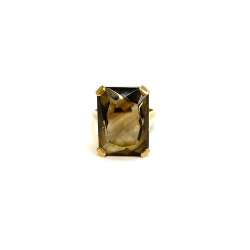 33 - A 9ct gold mounted smoky quartz cocktail ring, the quartz 2x1.4cm, size S, 8.1g