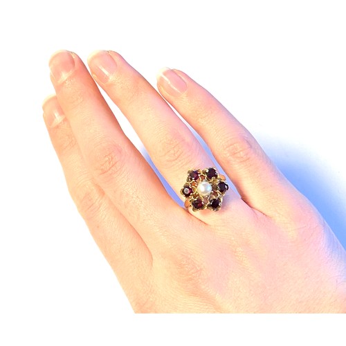 34 - A 9ct gold, garnet and pearl floral cluster form ring, size M 1/2, 3.5g