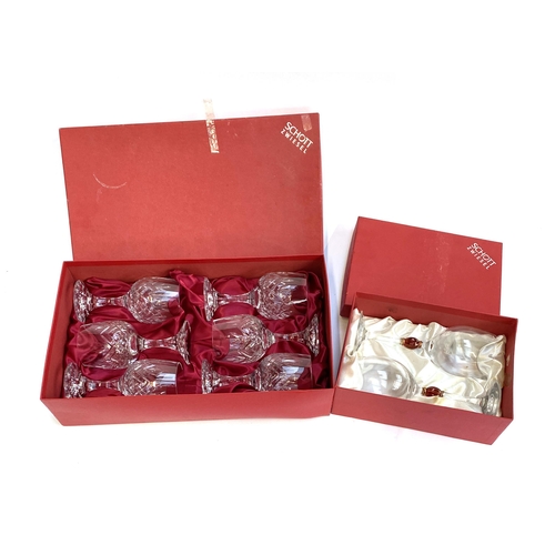 107 - A boxed set of six Schott Sweisel 'turner burgundy' wine glasses, 16cmH; together with a boxed pair ... 