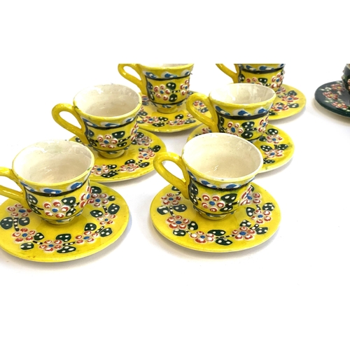 108 - Two sets of Italian studio pottery ceramic teacups and saucers, one in yellow glaze, the other dark ... 