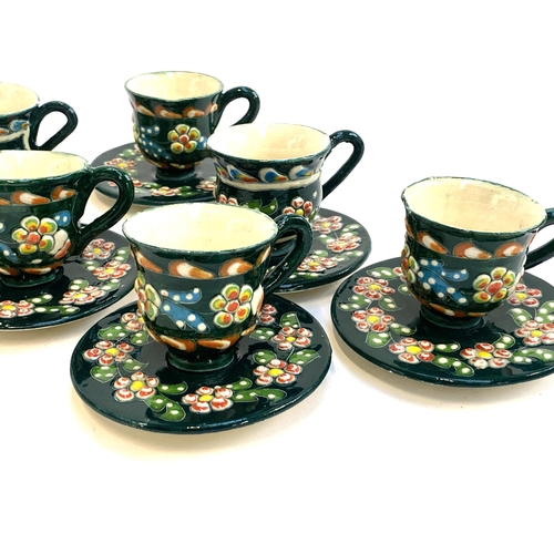 108 - Two sets of Italian studio pottery ceramic teacups and saucers, one in yellow glaze, the other dark ... 