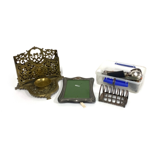 66 - A brass letter rack, silver plated toast rack, and various other plated items